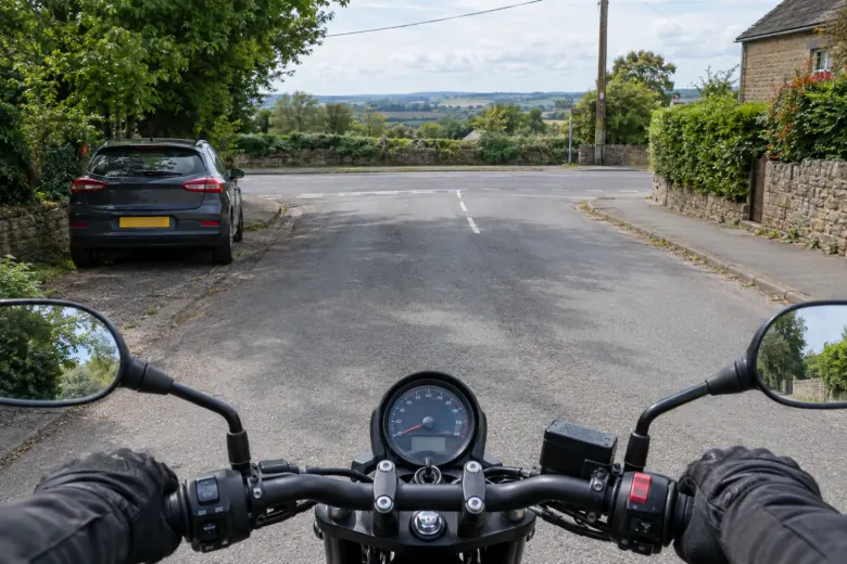 Rider’s view of a junction and parked car ahead