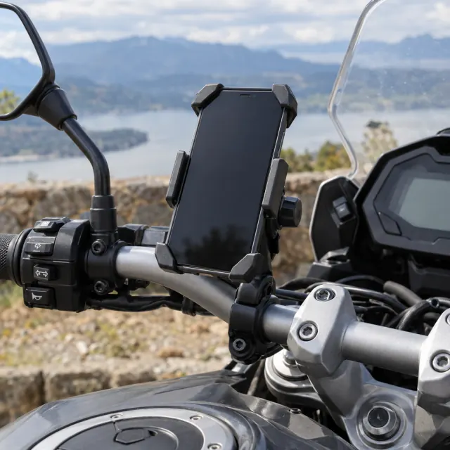 Phone held in a handlebar mount on a parked motorcycle