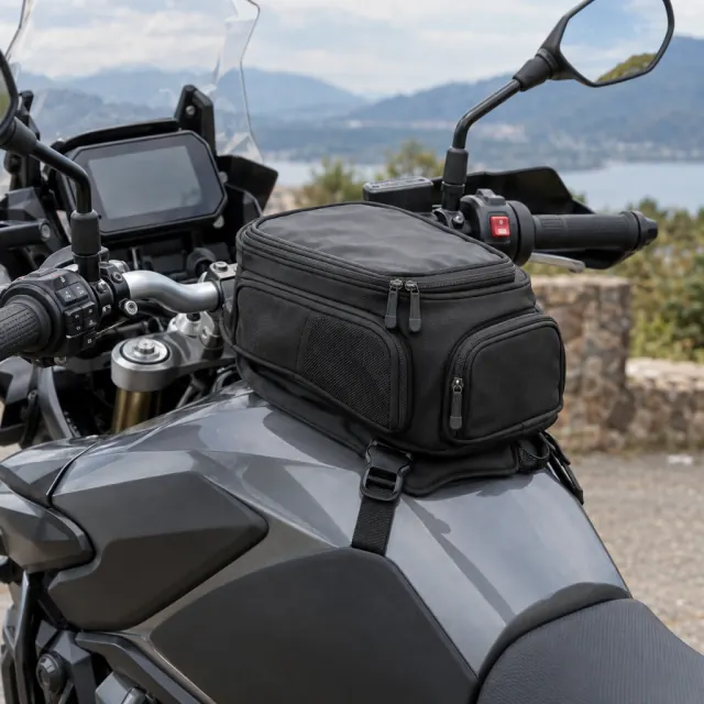 Compact tank bag fitted ahead of a motorcycle seat
